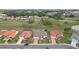Aerial view of the property showcasing green space, well-manicured lawn and landscaping at 1972 Wolf Laurel Dr, Sun City Center, FL 33573