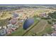 Beautiful aerial view of a residential community with ponds, walking paths, and well-maintained landscaping at 1972 Wolf Laurel Dr, Sun City Center, FL 33573
