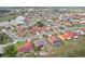 Scenic aerial view of a community with homes, a lake, and green spaces at 1972 Wolf Laurel Dr, Sun City Center, FL 33573