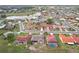 Community aerial view showcasing houses, landscaping, and the surrounding neighborhood at 1972 Wolf Laurel Dr, Sun City Center, FL 33573