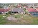 An aerial view of the yard with meticulous landscaping, a patio, and plenty of space at 1972 Wolf Laurel Dr, Sun City Center, FL 33573