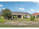 Beautiful backyard with a well-maintained lawn and covered lanai at 1972 Wolf Laurel Dr, Sun City Center, FL 33573