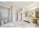 Bathroom boasts a shower, a walk-in closet, and a well-lit vanity area at 1972 Wolf Laurel Dr, Sun City Center, FL 33573