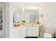 Bathroom area featuring an extended vanity, toilet, and walk-in shower at 1972 Wolf Laurel Dr, Sun City Center, FL 33573