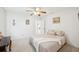 This spacious bedroom offers a serene retreat, complete with a ceiling fan and ample natural light at 1972 Wolf Laurel Dr, Sun City Center, FL 33573