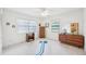 Bright bedroom with white walls, carpet, and window views, offering a serene and inviting space at 1972 Wolf Laurel Dr, Sun City Center, FL 33573