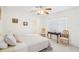 Cozy bedroom with white walls, complemented by a ceiling fan and inviting décor for a relaxing retreat at 1972 Wolf Laurel Dr, Sun City Center, FL 33573