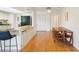 Cozy dining area featuring light wood floors and a breakfast bar adjacent to the kitchen at 1972 Wolf Laurel Dr, Sun City Center, FL 33573
