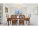 Elegant dining room with a stylish chandelier at 1972 Wolf Laurel Dr, Sun City Center, FL 33573