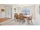 Bright dining room with a chandelier and access to the entry at 1972 Wolf Laurel Dr, Sun City Center, FL 33573