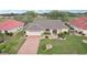 Beautiful single-Gathering home featuring lush landscaping and a brick-paved driveway at 1972 Wolf Laurel Dr, Sun City Center, FL 33573