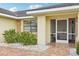 Charming front entrance with a screened porch and stone accents at 1972 Wolf Laurel Dr, Sun City Center, FL 33573