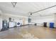 Spacious garage featuring laundry appliances and ample storage space at 1972 Wolf Laurel Dr, Sun City Center, FL 33573