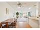Spacious open floorplan with dining and living spaces showcasing modern furniture and ample light at 1972 Wolf Laurel Dr, Sun City Center, FL 33573