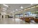 Bright lobby with tile flooring, high ceilings, a chandelier, and large windows providing natural light at 1972 Wolf Laurel Dr, Sun City Center, FL 33573
