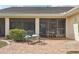 A brick paved patio has a metal bench and chairs; a cozy space for outdoor enjoyment at 1972 Wolf Laurel Dr, Sun City Center, FL 33573