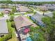 Overhead view of a home featuring a screened-in pool and well-maintained landscaping at 19836 Hidden Glen Dr, Land O Lakes, FL 34638