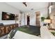 Comfortable bedroom with modern decor, large TV, and access to walk-in closet and en-suite bathroom at 19836 Hidden Glen Dr, Land O Lakes, FL 34638