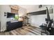 Cozy bedroom with sleek laminate floors, a large window, and built-in storage for an organized space at 19836 Hidden Glen Dr, Land O Lakes, FL 34638