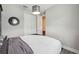 Bedroom featuring a unique overhead light fixture and a closet with white doors at 19836 Hidden Glen Dr, Land O Lakes, FL 34638