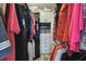 Organized walk-in closet featuring custom shelving and ample hanging space for clothes and accessories at 19836 Hidden Glen Dr, Land O Lakes, FL 34638