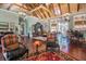 A cozy lounge area of a clubhouse featuring chairs, hardwood floors, decorated for the Halloween holiday at 19836 Hidden Glen Dr, Land O Lakes, FL 34638