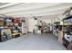 An organized garage with ample storage shelving and epoxy flooring at 19836 Hidden Glen Dr, Land O Lakes, FL 34638