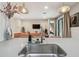 Contemporary kitchen with sleek faucet, quartz counters, open to the living area at 19836 Hidden Glen Dr, Land O Lakes, FL 34638