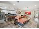 Inviting living room featuring a kitchen bar, an open layout, and stylish décor at 19836 Hidden Glen Dr, Land O Lakes, FL 34638