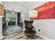Stylish office space with glass door, wood floors, large art and unique light fixture at 19836 Hidden Glen Dr, Land O Lakes, FL 34638