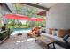 Relaxing screened-in patio featuring comfortable seating and views of the sparkling pool at 19836 Hidden Glen Dr, Land O Lakes, FL 34638