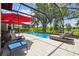 Inviting pool with ample lounge seating inside a screened-in enclosure at 19836 Hidden Glen Dr, Land O Lakes, FL 34638