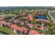 Aerial view of the community with buildings, a pool, parking and water features at 2400 Feather Sound Dr # 1235, Clearwater, FL 33762