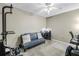 Versatile bedroom setup with a futon, desk, and exercise equipment for a functional living space at 2400 Feather Sound Dr # 1235, Clearwater, FL 33762