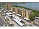 Aerial view of condos with covered parking and a view of the lake at 2617 Cove Cay Dr # 206, Clearwater, FL 33760