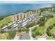 Condo aerial view featuring water, a golf course and parking at 2617 Cove Cay Dr # 206, Clearwater, FL 33760