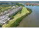 Breathtaking aerial view of waterfront condos bordered by green spaces and walking paths at 2617 Cove Cay Dr # 206, Clearwater, FL 33760