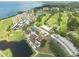 Scenic aerial view of the community featuring golf course, ponds, and waterfront condos at 2617 Cove Cay Dr # 206, Clearwater, FL 33760