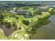 Stunning aerial view of golf course community featuring water features and mature trees at 2617 Cove Cay Dr # 206, Clearwater, FL 33760