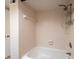 Clean bathroom with shower and tub featuring neutral tile and shower caddy at 2617 Cove Cay Dr # 206, Clearwater, FL 33760
