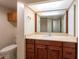 Bathroom featuring a vanity with storage and a large mirror at 2617 Cove Cay Dr # 206, Clearwater, FL 33760
