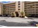 Close up on building entrance with covered parking and manicured landscaping at 2617 Cove Cay Dr # 206, Clearwater, FL 33760