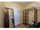 Functional walk-in closet with wood floors, shelving, and a full-length mirror at 2617 Cove Cay Dr # 206, Clearwater, FL 33760