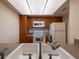Kitchen sink featuring laminate countertops and warm wood cabinets at 2617 Cove Cay Dr # 206, Clearwater, FL 33760