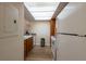 Efficient kitchen layout with white appliances and laminate countertops at 2617 Cove Cay Dr # 206, Clearwater, FL 33760