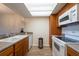 Functional kitchen featuring white appliances and ample counter space at 2617 Cove Cay Dr # 206, Clearwater, FL 33760