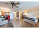 Spacious living area with a bed and an open floor plan to the kitchen at 2617 Cove Cay Dr # 206, Clearwater, FL 33760