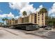 Community with covered parking, palm trees, and well-maintained exteriors, offering convenience at 2617 Cove Cay Dr # 206, Clearwater, FL 33760