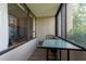 Enclosed patio providing extra space, featuring a table and seating area at 2617 Cove Cay Dr # 206, Clearwater, FL 33760