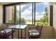Relaxing patio with view, featuring table and chairs for outdoor enjoyment at 2617 Cove Cay Dr # 206, Clearwater, FL 33760